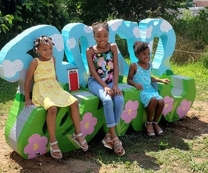 Take a photo at Tiny Doors ATL's door #6, featured in a custom bench by artist Ira Hill, located on the Beltline Eastside trail. Photo courtesy of Tiny Doors ATL