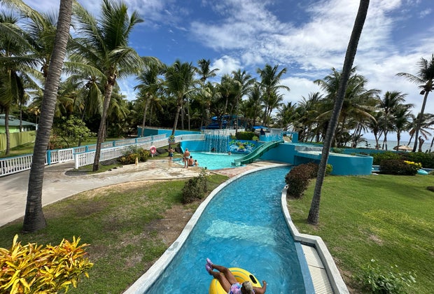 Kids can go down the water slides while parents float along the lazy river at Coconut Bay Beach Resort.