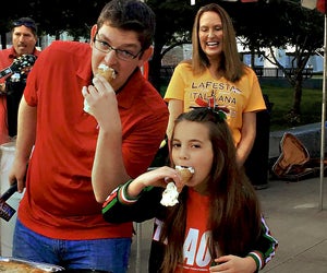 Indulge in a giant cannoli at the La Italia Fest.